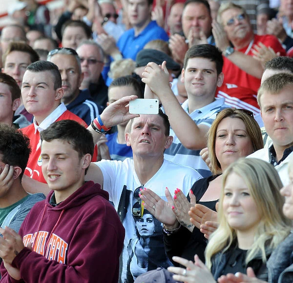 Bristol City Fan Cheers at Ashton Gate during Bristol City vs Colchester United, Sky Bet League One (16 / 08 / 2014)