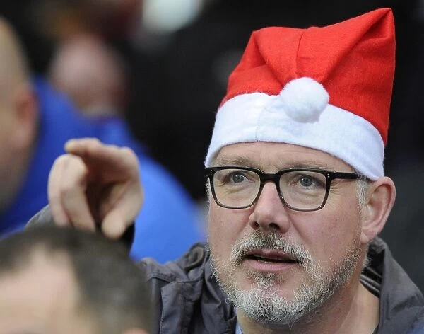 Bristol City Fan in Christmas Hat Celebrates at Ashton Gate Stadium during Sky Bet Championship Match