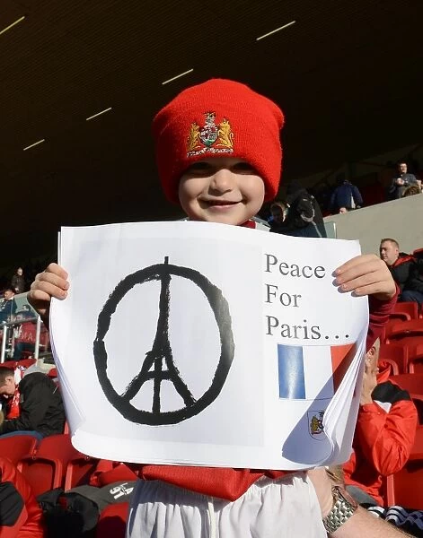 Bristol City Fan Honors Paris with Peace Sign at Ashton Gate during Bristol City vs Hull City Match, 2015