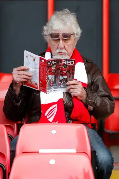 Framed Print : Bristol City Fan Perusing Match Program Before FA Cup Encounter vs. West Ham United, 2015 Framed Print : Bristol City Fan Perusing Match Program Before FA Cup Encounter vs. West Ham United, 2015