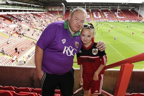 Bristol City Fan in Purple and Green Kit at Sheffield United's Bramal Lane for Sky Bet League One Opener