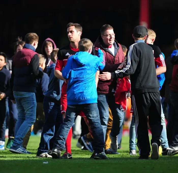 Framed Print : Bristol City Fans Celebrate Promotion to Championship with Euphoric Pitch Invasion