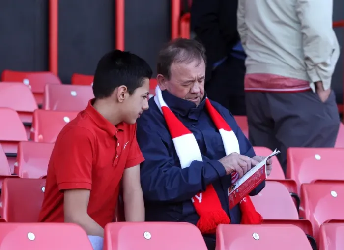 Framed Print : Bristol City Fans Engrossed in Match Day Programme during Bristol City v Coventry City Game, Ashton Gate, 2015 Framed Print : Bristol City Fans Engrossed in Match Day Programme during Bristol City v Coventry City Game, Ashton Gate, 2015
