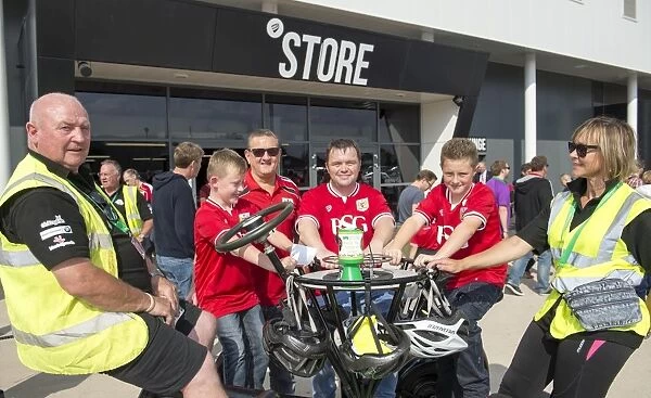 Bristol City Fans Ride for a Cause: Seven-Seater Bike Demonstration at Ashton Gate Stadium for Children's Hospice South West