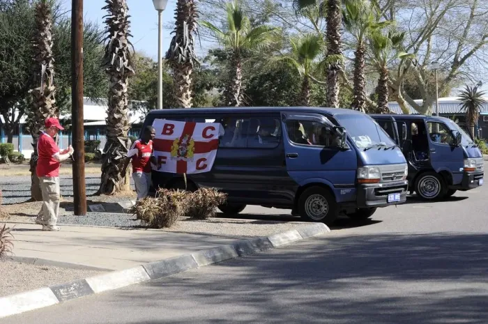Framed Print : Bristol City Fans Transporting Team Flag to Botswana Stadium for Extension Gunners Match