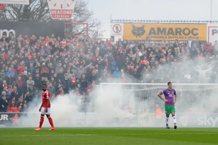 Framed Print : Bristol City Fans Unleash Smoke at Swindon Town's County Ground During Sky Bet League One Match Framed Print : Bristol City Fans Unleash Smoke at Swindon Town's County Ground During Sky Bet League One Match