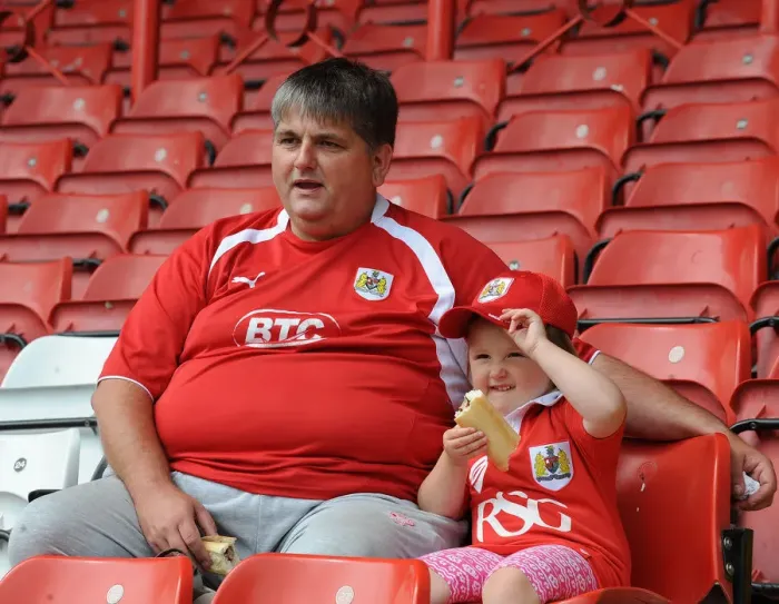 Framed Print : Bristol City Fans Watch Intently as the Action Unfolds at Ashton Gate