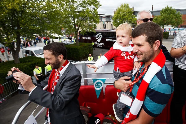 Bristol City FC: Champions Triumph - Vice Chairman Jon Lansdown and Son Amidst the Cheers of the Bus Parade Crowd