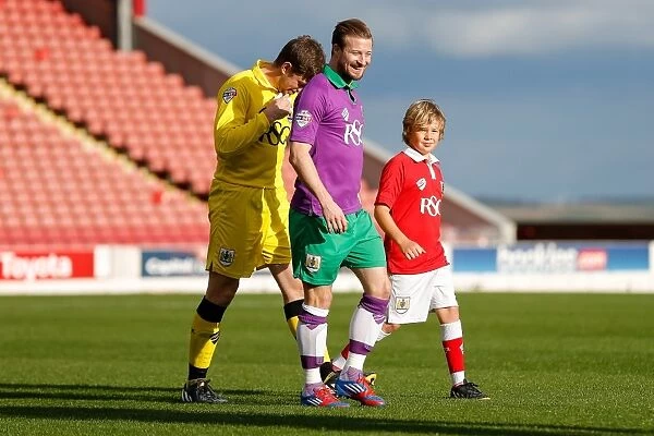 Bristol City FC: Frank Fielding and Wade Elliott Leading the Team Out at Oakwell Stadium against Barnsley (October 2014)