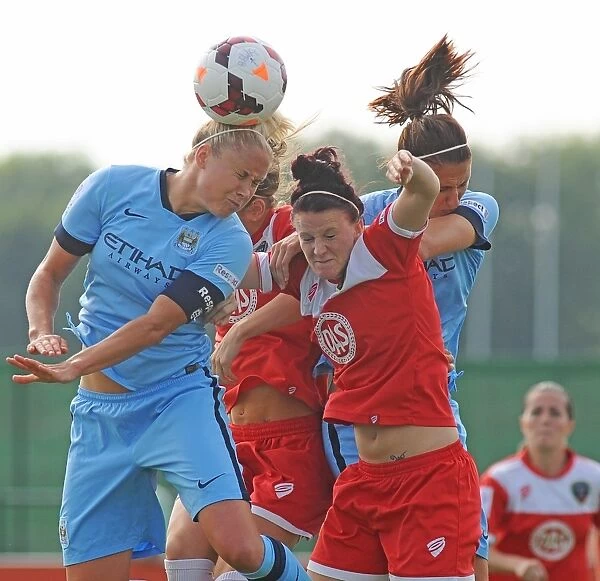 Bristol City FC: Jasmine Matthews Fights for Possession in Mid-Air during BAWFC vs Man City Ladies Match, September 2014