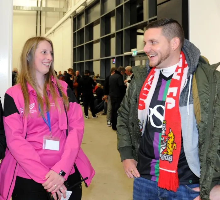 Framed Print : Bristol City FC: Matchday Ambassador Assists Spectator at Ashton Gate Stadium Framed Print : Bristol City FC: Matchday Ambassador Assists Spectator at Ashton Gate Stadium