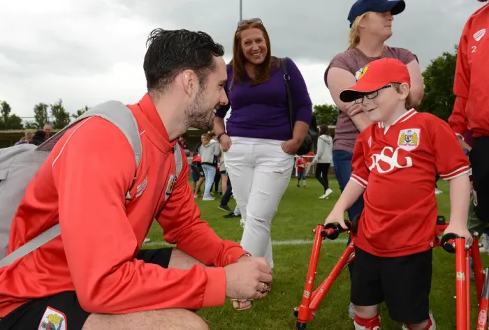 Framed Print : Bristol City FC: Pre-Season Friendly - Greg Cunningham Engages with Young Fan Oskar Pycroft