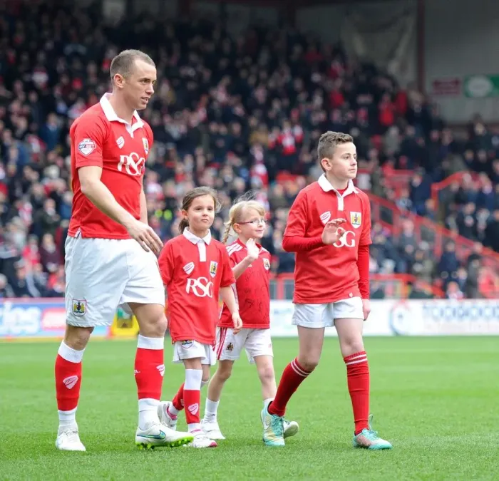 Framed Print : Bristol City Football Club: Mascots Accompany Aaron Wilbraham onto Ashton Gate Pitch vs Gillingham (140315)