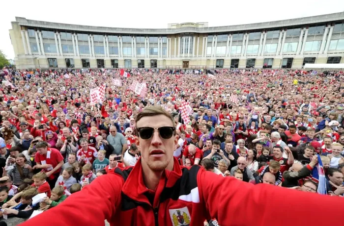 Framed Print : Bristol City Football Club: Aden Flint Amid Thousands of Fans during the Celebration Tour (May 2015) Framed Print : Bristol City Football Club: Aden Flint Amid Thousands of Fans during the Celebration Tour (May 2015)