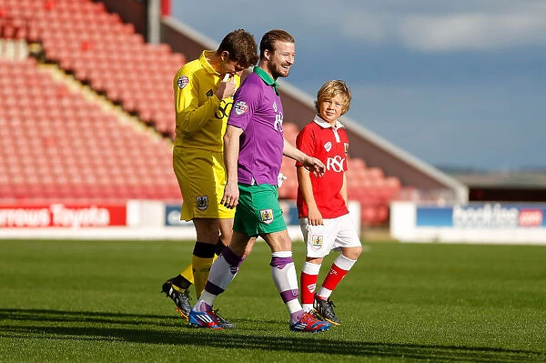 Bristol City Football Club: Frank Fielding and Wade Elliott Leading the Team Out at Oakwell Stadium against Barnsley, 25th October 2014