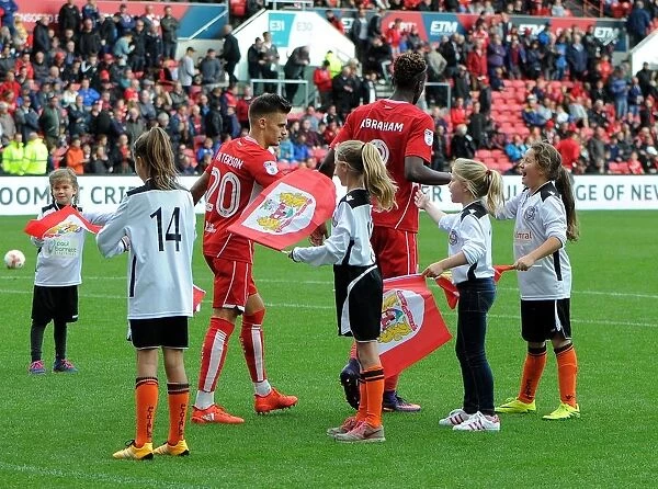 Bristol City Football Club: Jamie Paterson and Tammy Abraham with Portishead Town Flag Bearers at Ashton Gate Stadium during Bristol City vs. Nottingham Forest (Sky Bet Championship)
