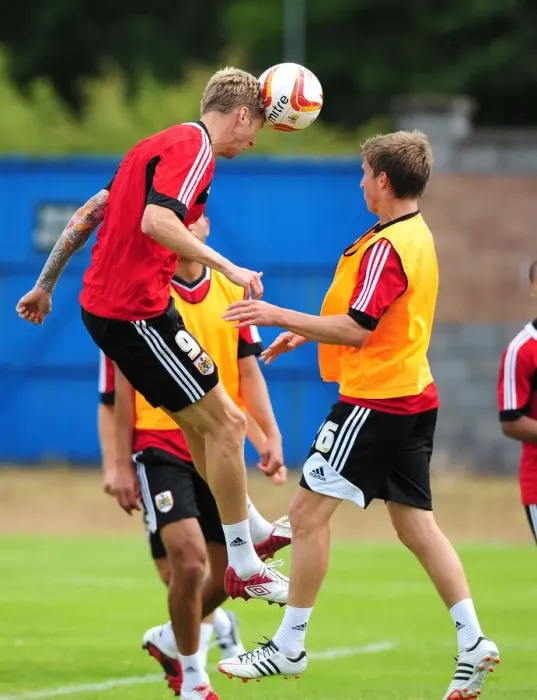 Framed Print : Bristol City Football Club: Jon Stead vs Joe Bryan - Aerial Battle in Pre-Season Training, 2012