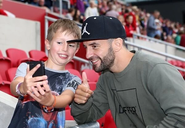 Bristol City Football Club: Lee Haskins Interacts with Fans at Ashton Gate Stadium during Derby County Match