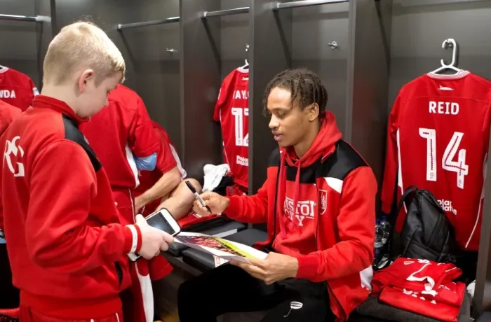 Framed Print : Bristol City Football Club: Mascots and Players Unite in the Dressing Room