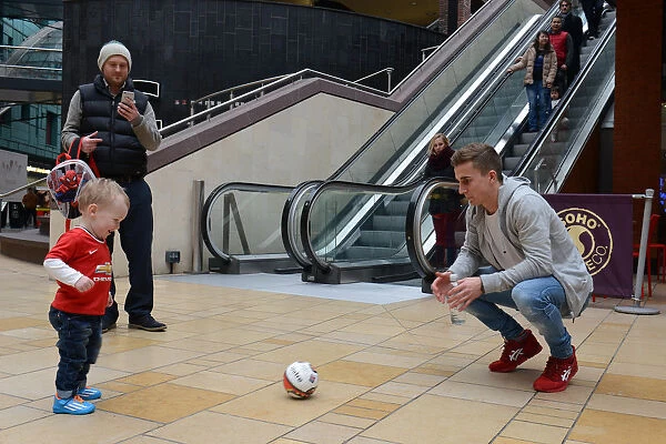 Bristol City Footballer Joe Bryan Plays with Young Fan at Cabot Circus during Johnstones Paint Trophy Match