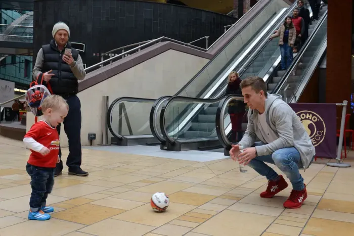 Framed Print : Bristol City Footballer Joe Bryan Plays with Young Fan at Cabot Circus during Johnstones Paint Trophy Match Framed Print : Bristol City Footballer Joe Bryan Plays with Young Fan at Cabot Circus during Johnstones Paint Trophy Match