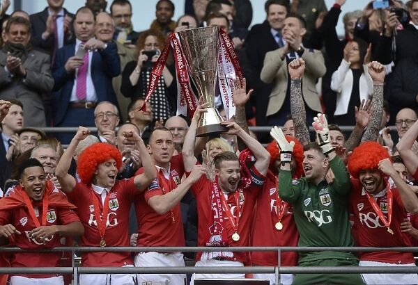 Bristol City Footballers Aaron Wilbraham and Wade Elliott Lift the Johnstone's Paint Trophy at Wembley Stadium after Winning against Walsall