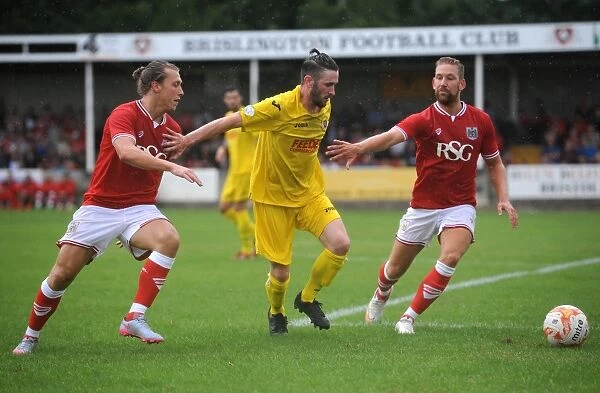 Bristol City Footballers Clash for the Ball: Luke Freeman vs. Liam Knight in Pre-Season Friendly