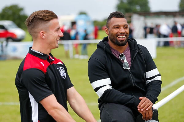 Bristol City Footballers Jamal Ford-Robinson and Joe Bryan Engage in Post-Match Chat at Hengrove Athletic