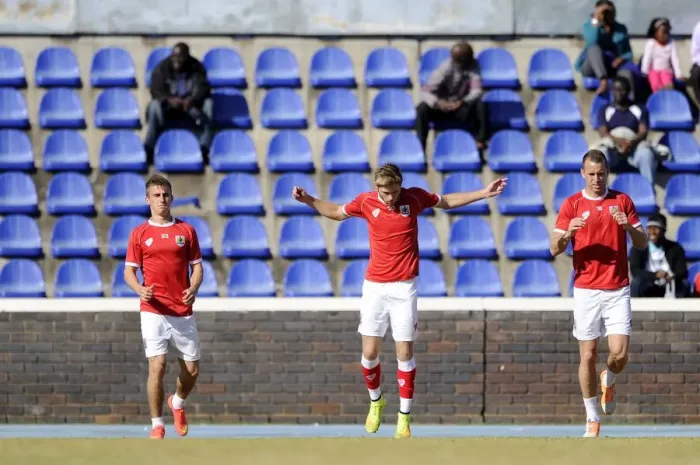 Framed Print : Bristol City Footballers Joe Bryan, Wes Burns, and Aaron Wilbraham Warm Up Ahead of Extension Gunners Match, 2014