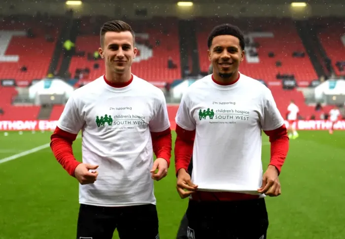Framed Print : Bristol City Footballers Joe Bryan and Korey Smith Display Children's Hospice South West Support Shirts vs Burton Albion (04 / 03 / 2017) Framed Print : Bristol City Footballers Joe Bryan and Korey Smith Display Children's Hospice South West Support Shirts vs Burton Albion (04 / 03 / 2017)