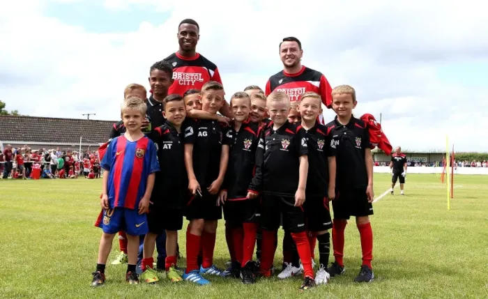Framed Print : Bristol City Footballers Jonathan Kodjia and Lee Tomlin Engage with Young Fans at Hengrove Athletic Pre-season Match Framed Print : Bristol City Footballers Jonathan Kodjia and Lee Tomlin Engage with Young Fans at Hengrove Athletic Pre-season Match