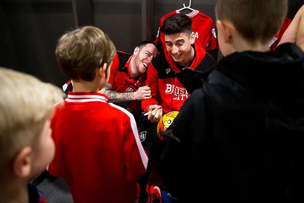 Bristol City Footballers Share a Laugh with Mascots Before Match vs. Huddersfield Town