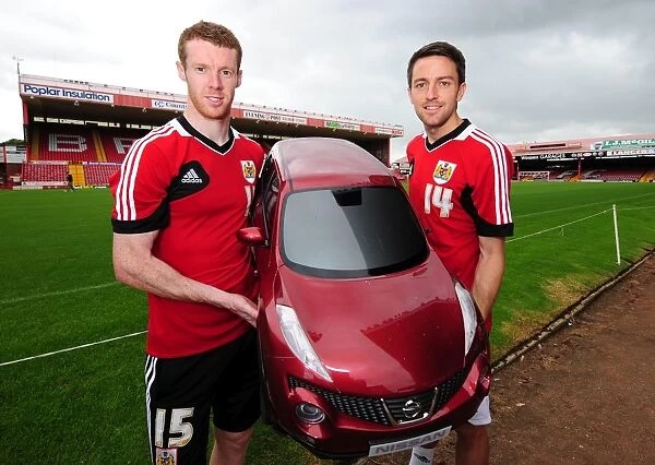 Bristol City Footballers Stephen Pearson and Cole Skuse with Wessex Garages Baby Duke at Pre-Season Open Day