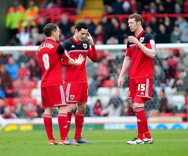Bristol City: Gregg Cunningham Discusses Injury with Team Mates during Middlesbrough Match, 09-03-2013