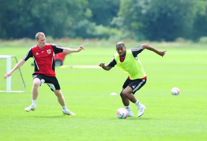 Framed Print : Bristol City: Intense Training Battle between Marvin Elliott and David Clarkson