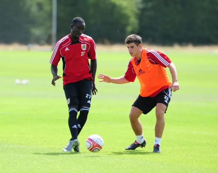 Framed Print : Bristol City: Intense Training Moment - Albert Adomah vs. Joe Edwards Battling for the Ball Framed Print : Bristol City: Intense Training Moment - Albert Adomah vs. Joe Edwards Battling for the Ball