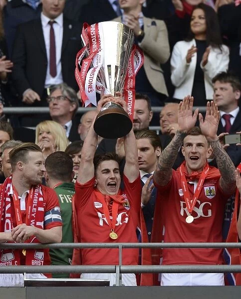 Bristol City Lifts Johnstone's Paint Trophy: Joe Bryan Celebrates Victory Against Walsall at Wembley Stadium