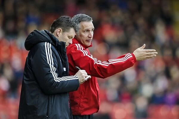 Bristol City Manager Steve Cotterill and Assistant John Pemberton in Deep Discussion during Bristol City vs Gillingham (2014)