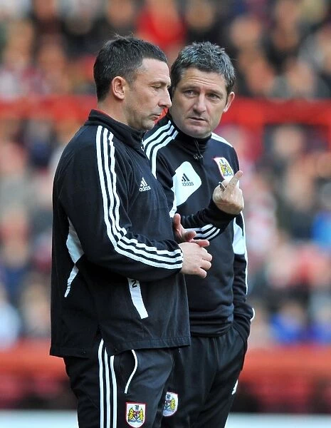 Bristol City Managers Derek McInnes and Tony Docherty Discussing Tactics Ahead of Championship Match