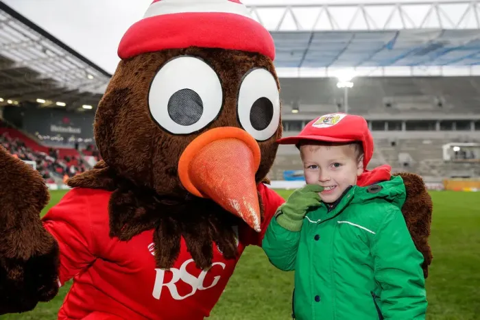 Framed Print : Bristol City Mascot Scrumpy Delights Young Fan with Cap Presentation at Ashton Gate Stadium Framed Print : Bristol City Mascot Scrumpy Delights Young Fan with Cap Presentation at Ashton Gate Stadium
