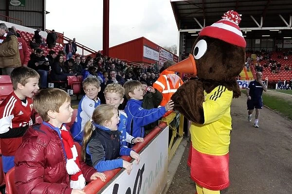 Bristol City Mascot, Scrumpy, Engages with Young Fans at Ashton Gate during Bristol City vs Gillingham Match, Sky Bet League One
