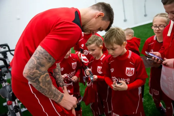 Framed Print : Bristol City: Mascots and Players Unite in the Dressing Room Framed Print : Bristol City: Mascots and Players Unite in the Dressing Room