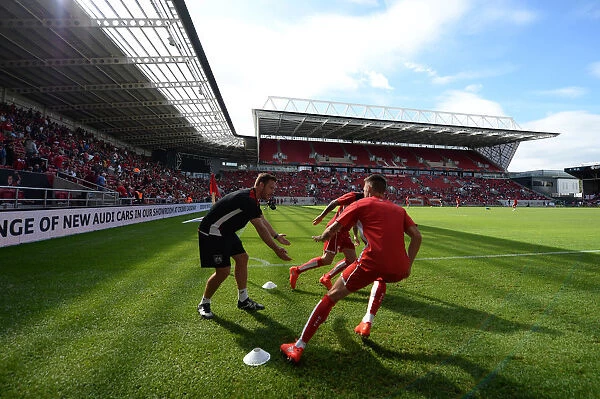 Bristol City Players Warm Up Ahead of Derby County Showdown at Ashton Gate Stadium