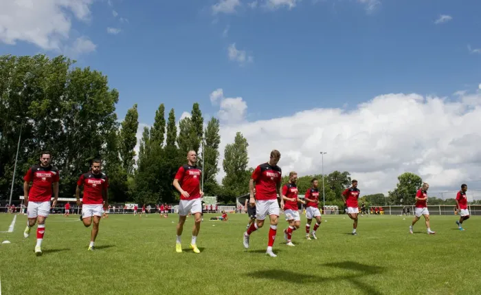 Framed Print : Bristol City Players Warm Up Ahead of Pre-Season Friendly at Brislington Stadium