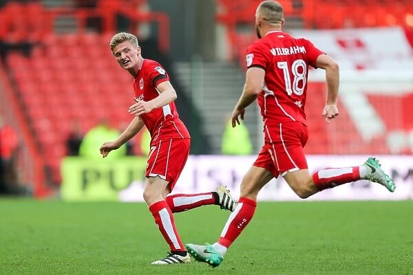 Bristol City Takes the Lead: Moore and Wilbraham Celebrate First Goal