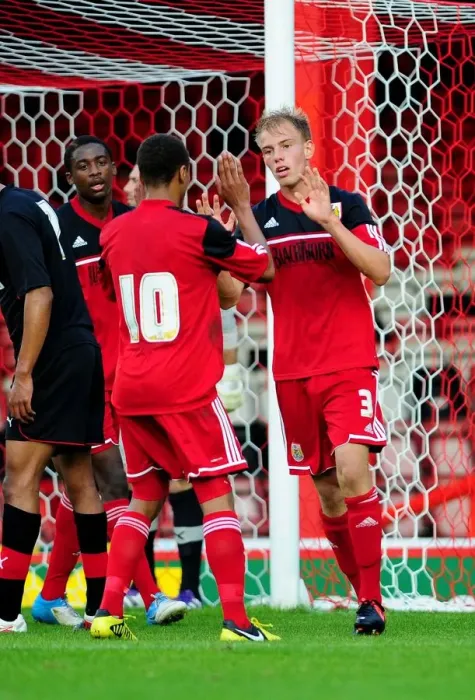 Framed Print : Bristol City U21s Celebrate Win: Bobby Reid Congratulates Tom King Framed Print : Bristol City U21s Celebrate Win: Bobby Reid Congratulates Tom King