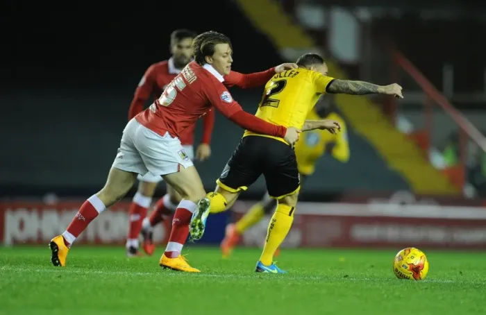 Framed Print : Bristol City vs AFC Wimbledon: Karleigh Osborne Holds Back Barry Fuller
