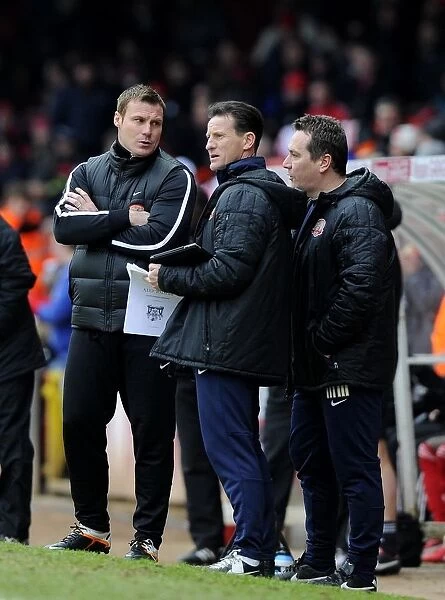Bristol City vs Barnsley: David Flitcroft's Intense Discussion with Backroom Staff during Npower Championship Match (February 2013)