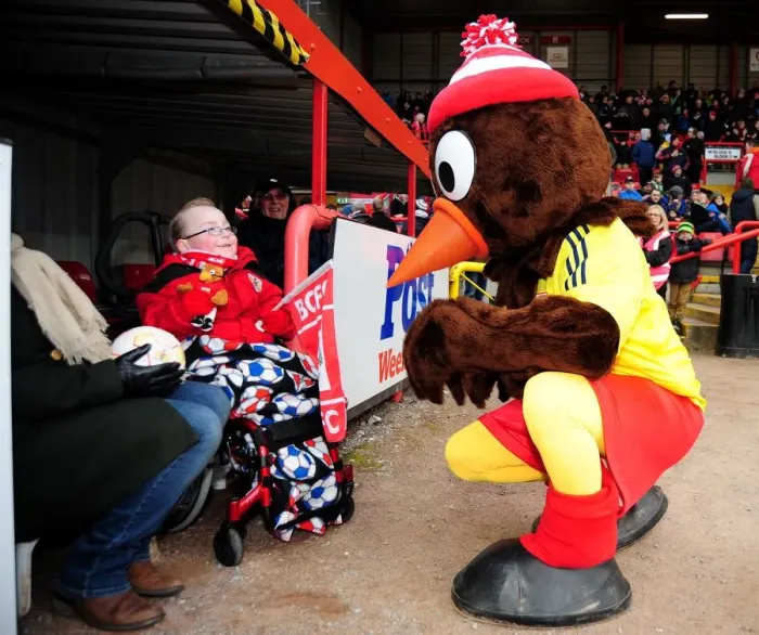 Framed Print : Bristol City vs Barnsley: A Heartwarming Moment Between Scrumpy and a Young Fan Framed Print : Bristol City vs Barnsley: A Heartwarming Moment Between Scrumpy and a Young Fan
