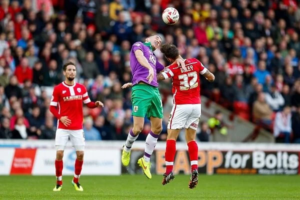 Bristol City vs Barnsley: Intense Aerial Battle Between Aaron Wilbraham and James Bailey